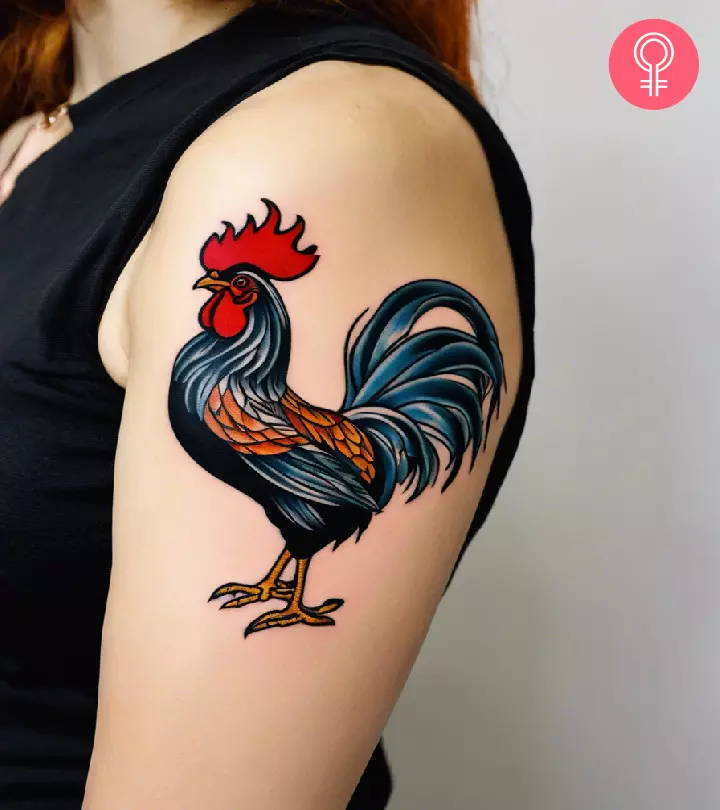 Traditional rooster tattoo on the upper arm