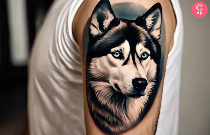 Siberian husky tattoo on the upper arm