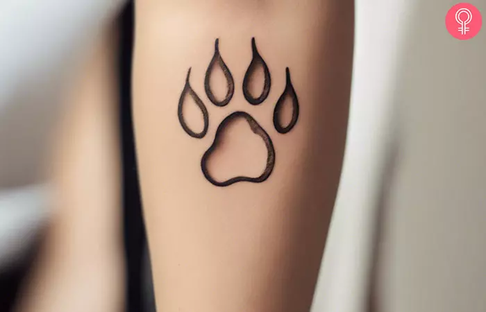 A simple small paw print tattoo outline