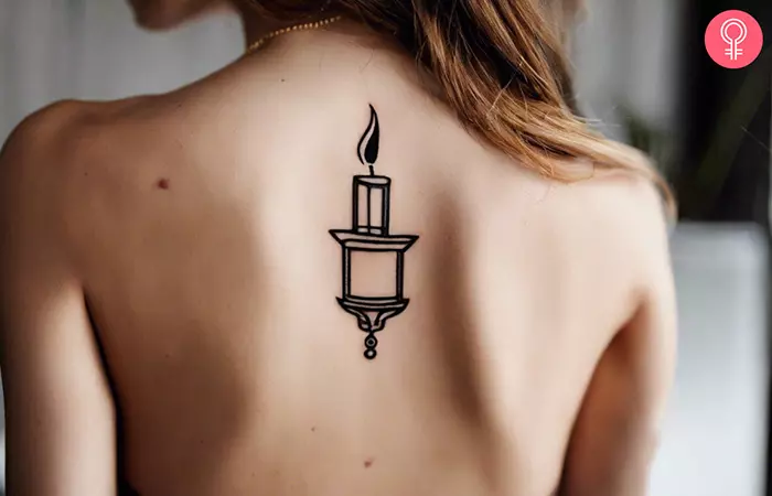 Simple candle tattoo