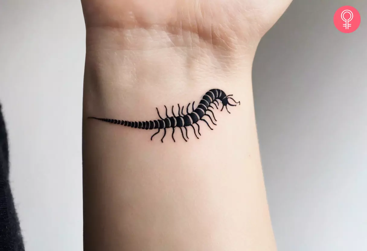 Simple centipede tattoo on the wrist