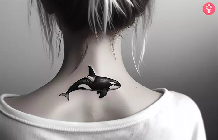 A small orca tattoo at the nape