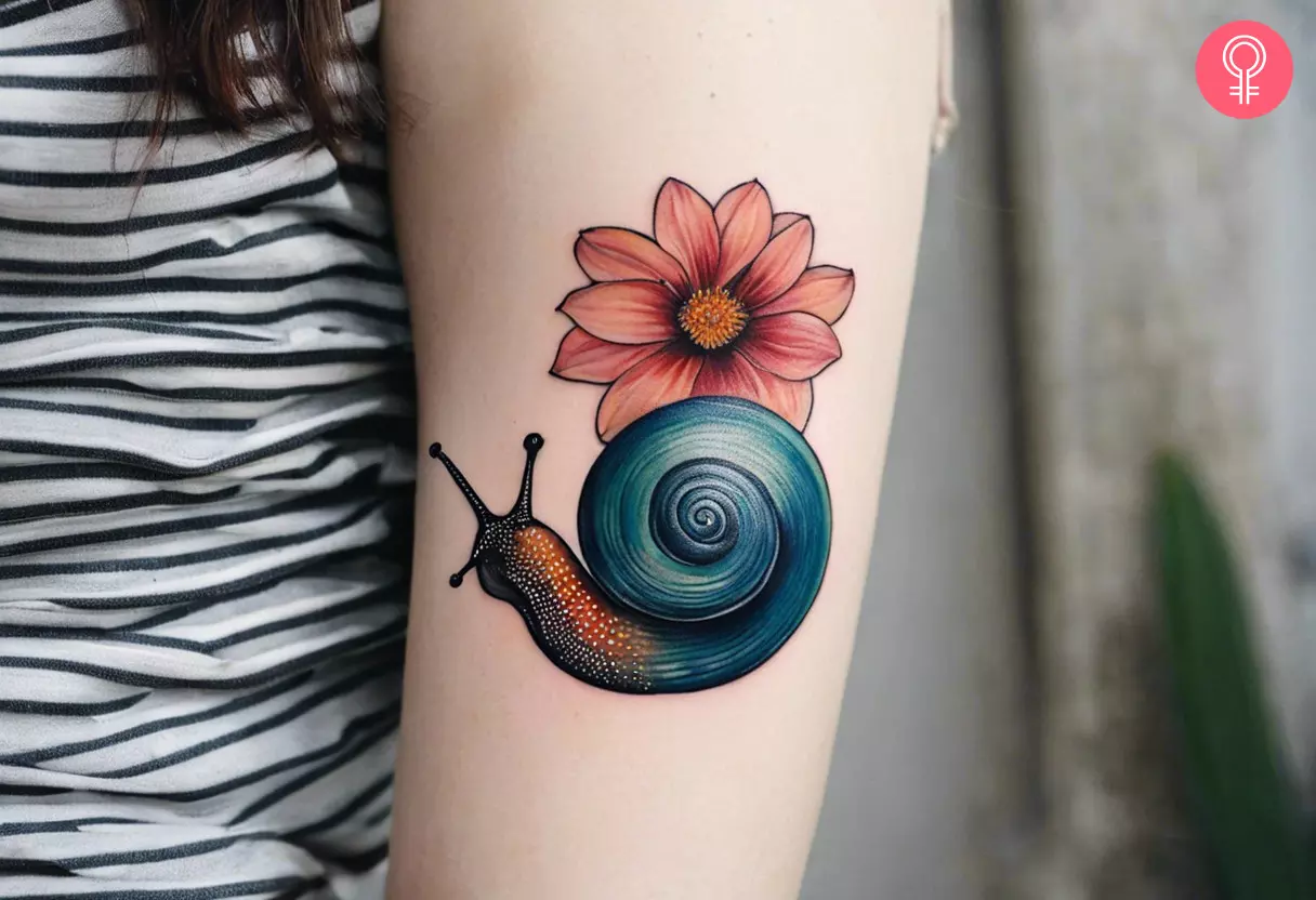 Snail flower tattoo on the upper arm