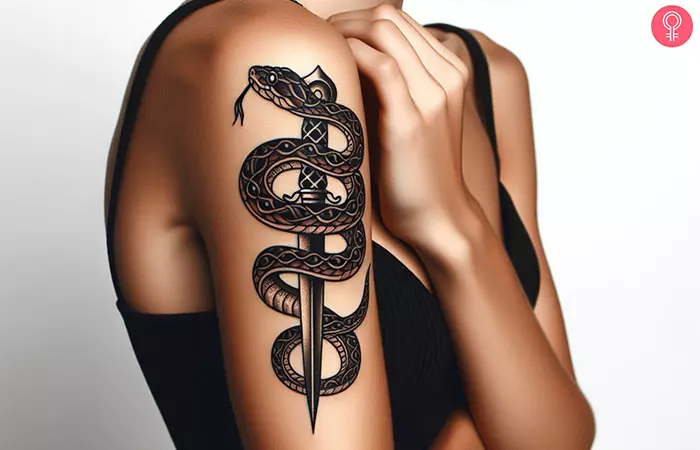 A woman with a snake and dagger tattoo on her upper arm