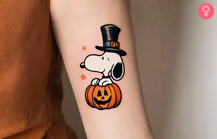 Snoopy Halloween tattoo on the forearm