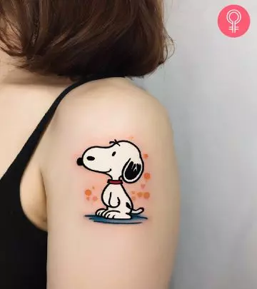 Revisit your happy memories of childhood by embracing the cute ‘Snoopy’ tattoo on your skin.  