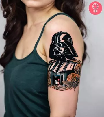 A robot tattoo on a woman’s upper arm