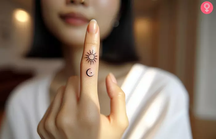 Sun and moon tattoo on the finger