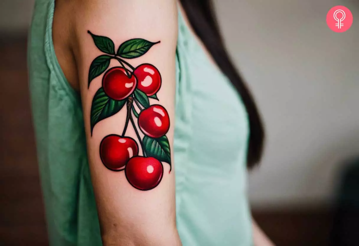 A traditional cherry tattoo on the forearm