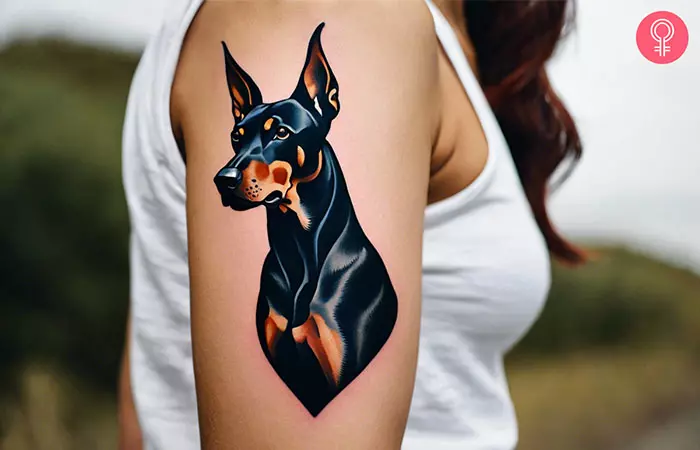 A traditional Doberman tattoo on the upper arm