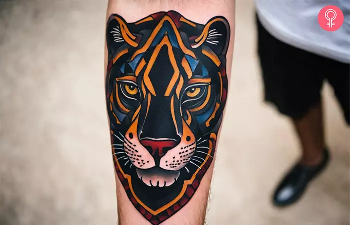 Traditional panther head tattoo on the forearm