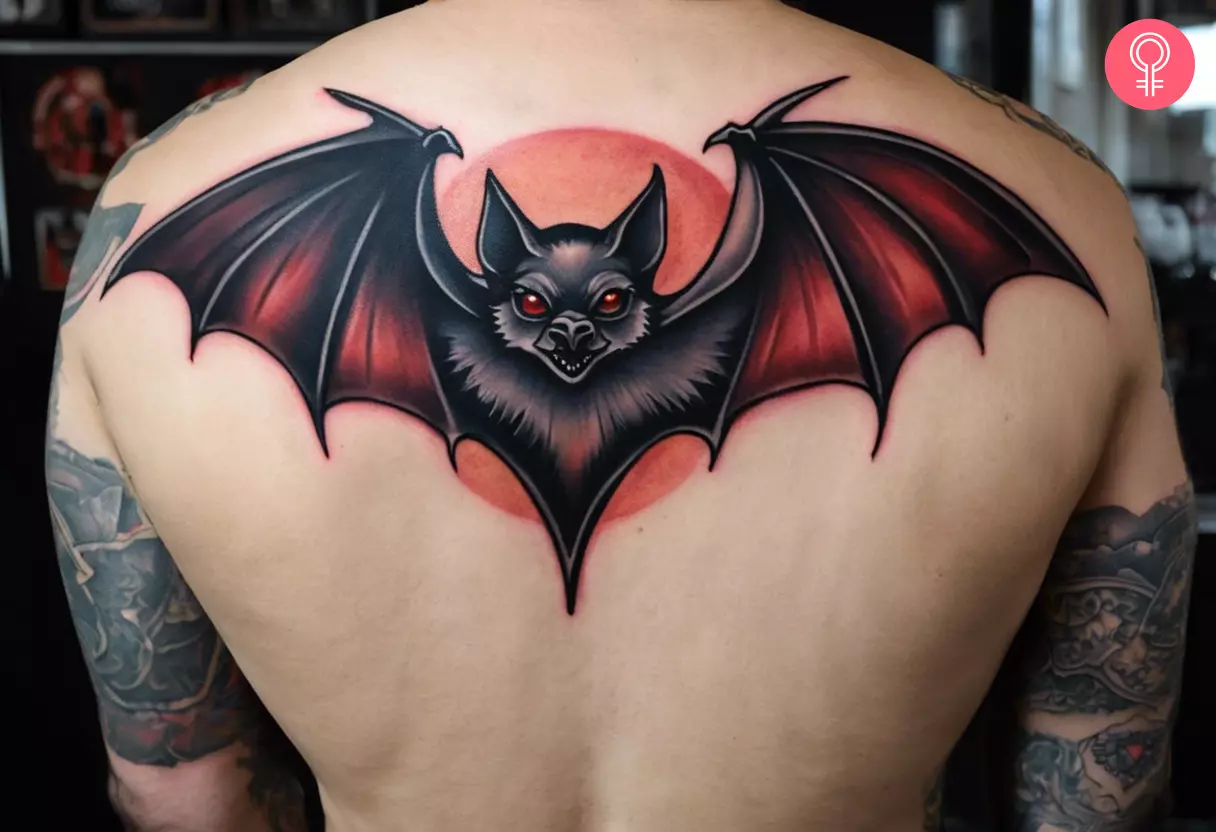 A flying vampire bat tattoo on a man’s back