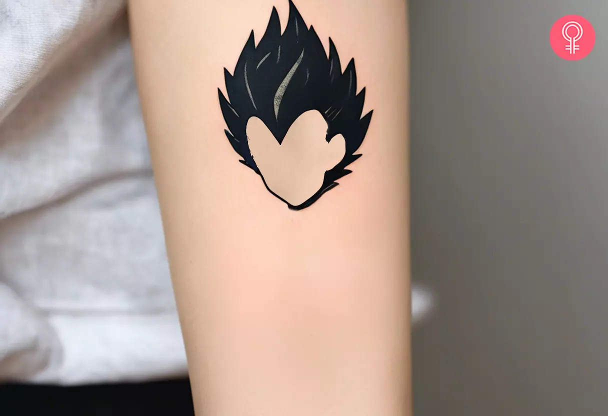A Vegeta hair tattoo on the arm