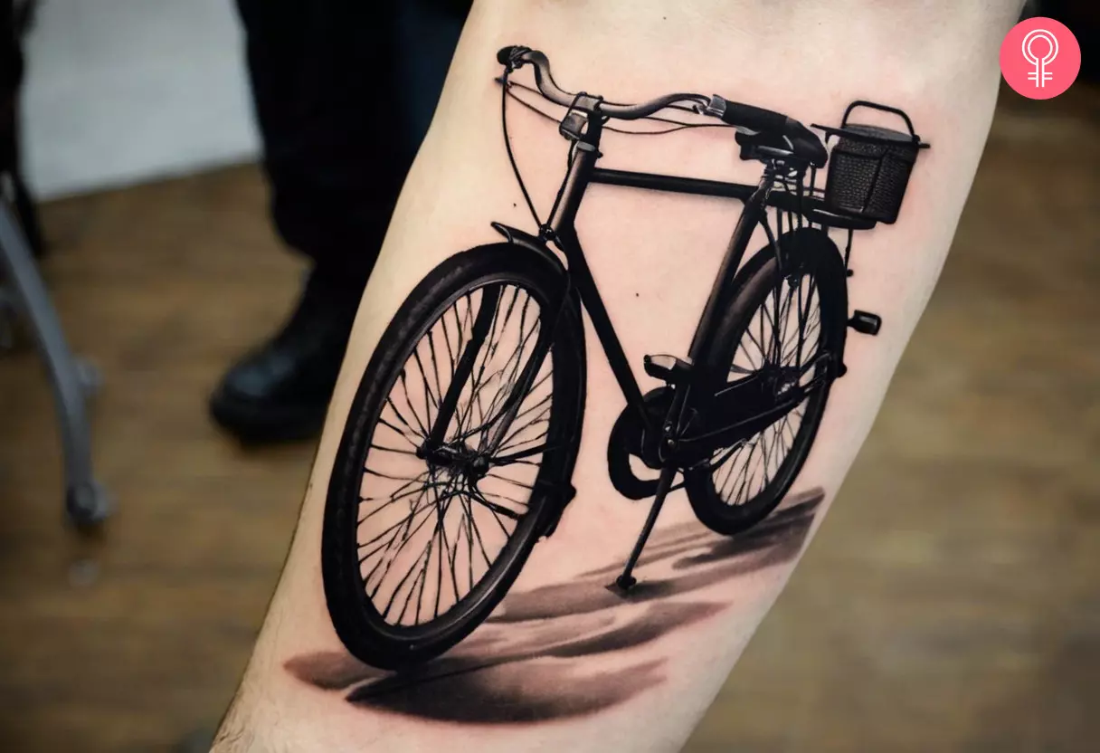 A vintage bike tattoo on the forearm