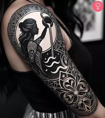 A black ink forearm tattoo with a trident of Poseidon