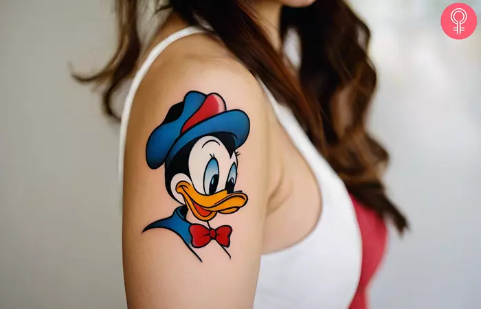 Woman with Donald Duck tattoo on her arm