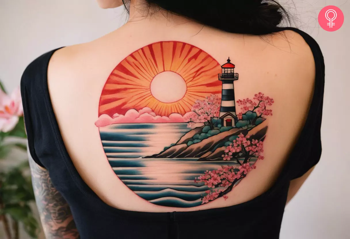 Woman with Japanese lighthouse tattoo on her upper back