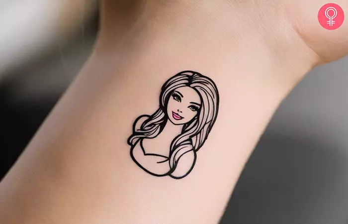 Woman with a Barbie tattoo on her wrist