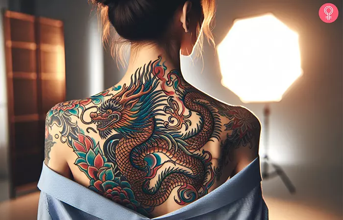 Woman with a Chinese dragon back tattoo