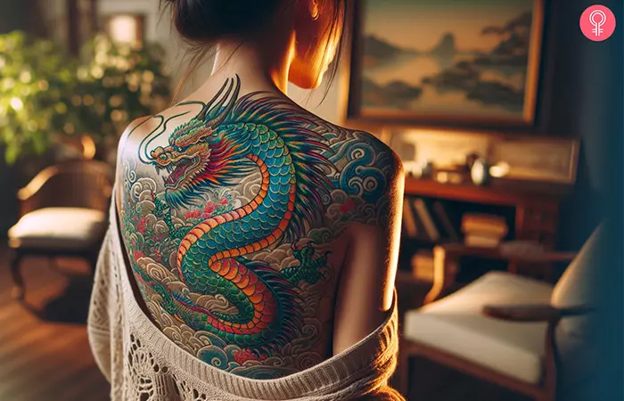 Woman with a Japanese dragon back tattoo