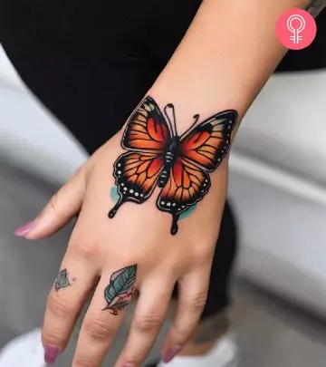 A woman with a monarch butterfly tattoo