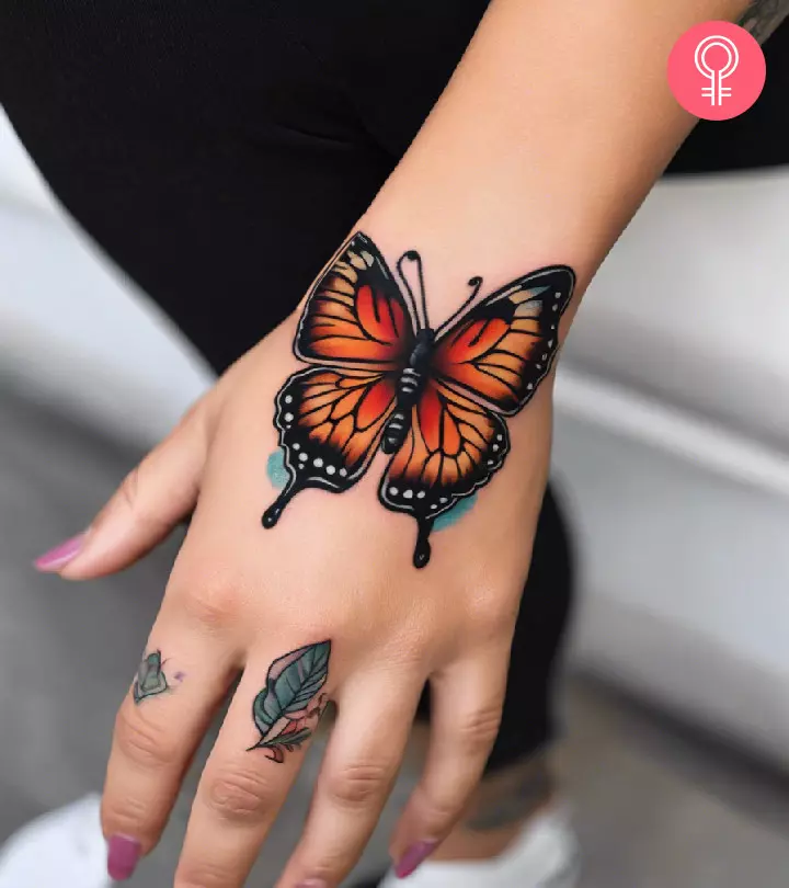 Woman with a butterfly hand tattoo
