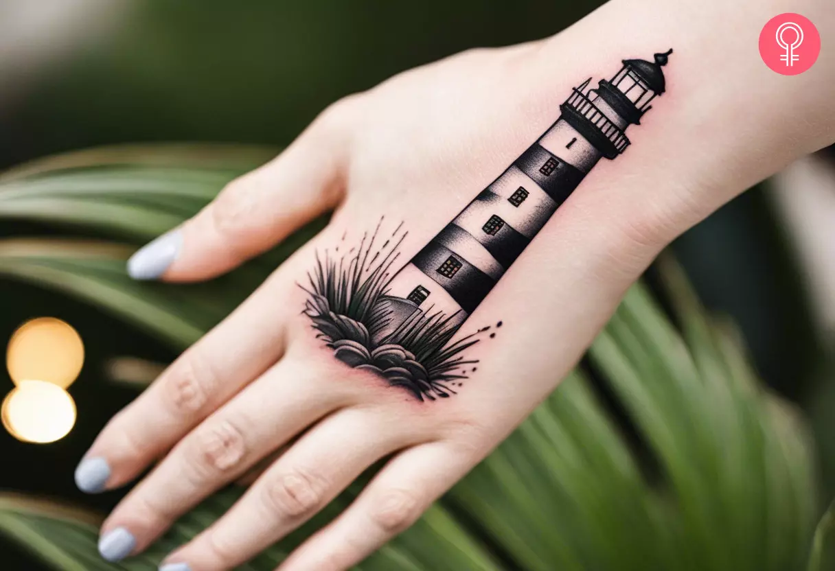 Woman with a dotted lighthouse tattoo on the back of her hand