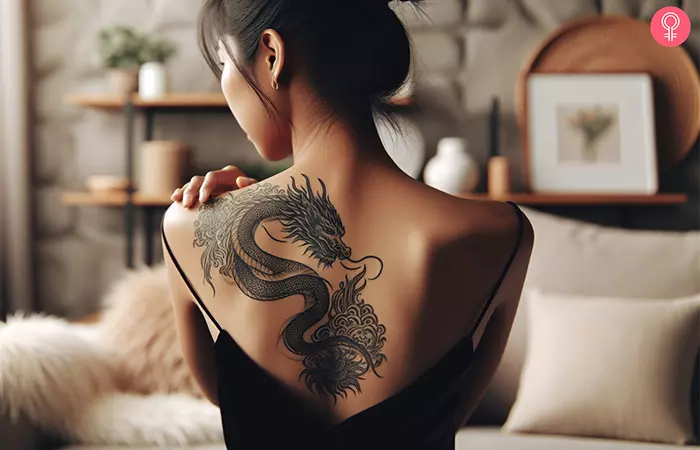 Woman with a female dragon back tattoo