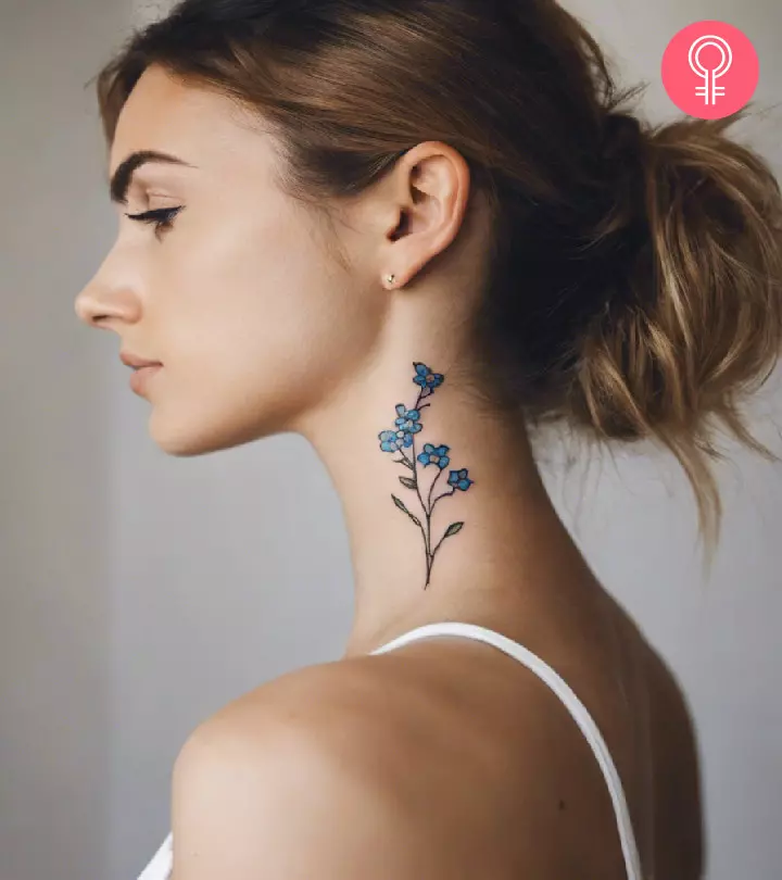 Woman with a forget me not flower tattoo on the neck