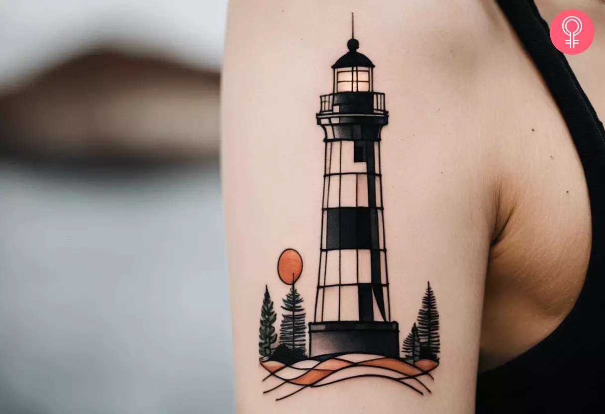 Woman with a geometric lighthouse tattoo on her upper arm