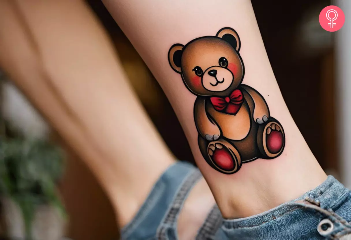 Woman with a neo-traditional teddy bear tattoo on her ankle