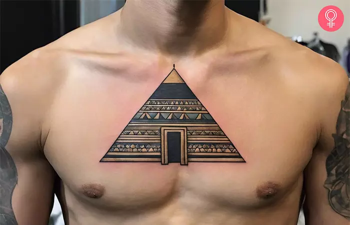 Woman with a pyramid tattoo on the chest