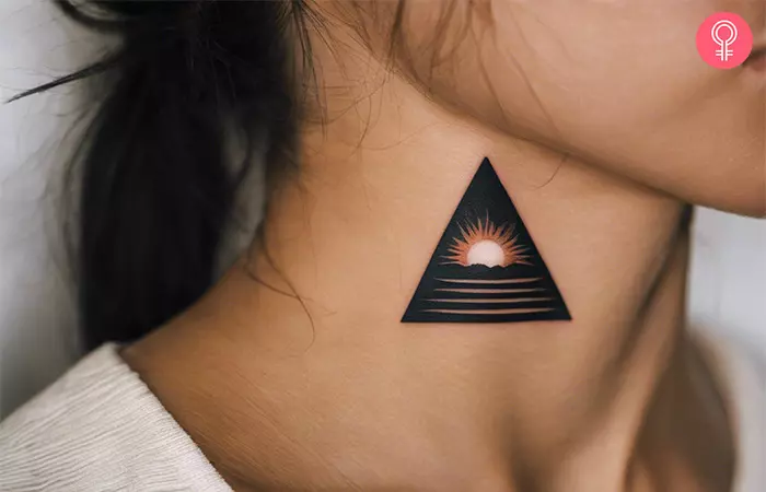 Woman with a pyramid tattoo on the neck