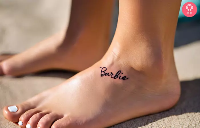 Woman with a tattoo of the word ‘Barbie’