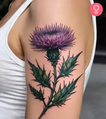 Poppy flower tattoo on a woman’s arm