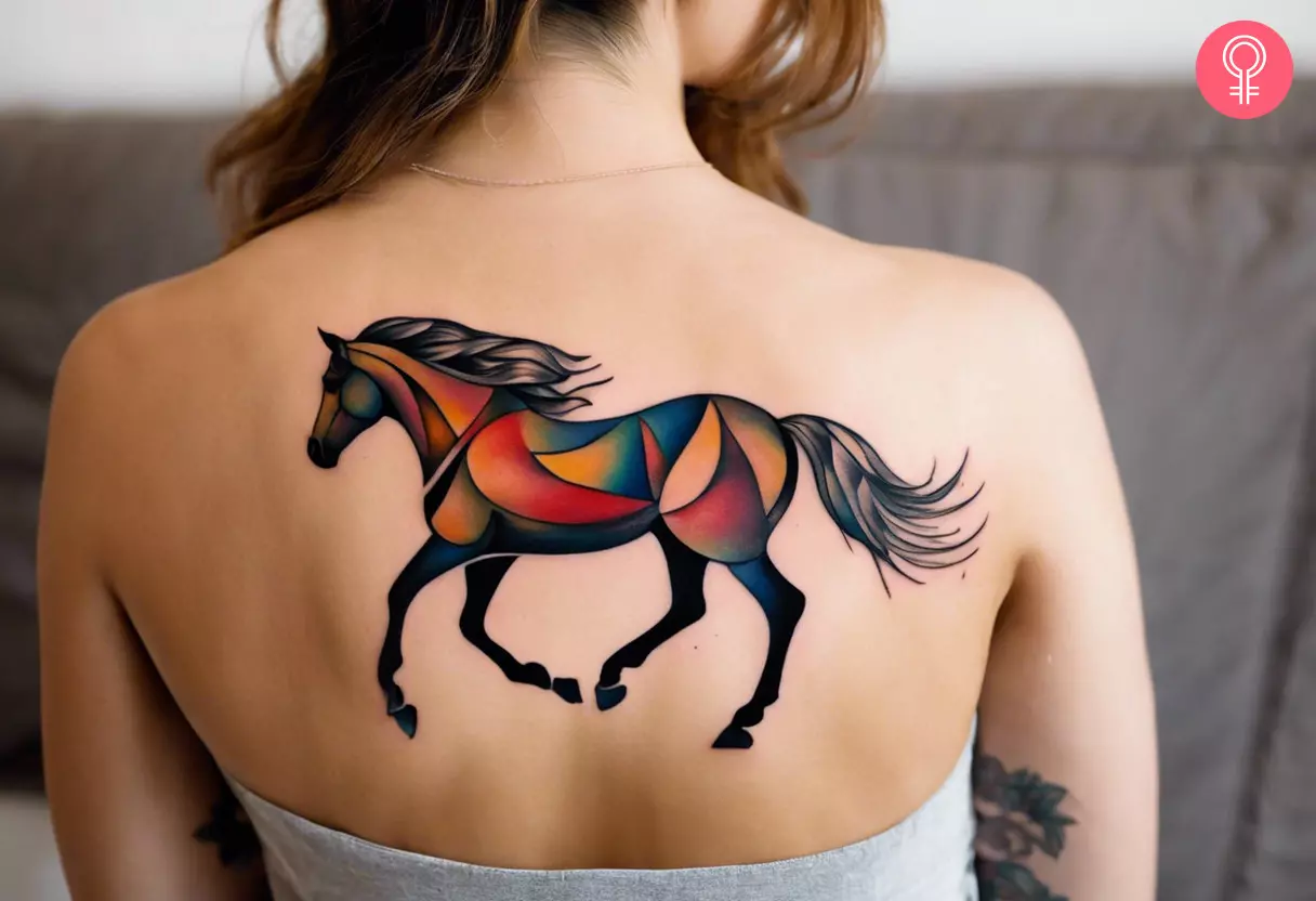 Woman with an abstract horse tattoo on her back