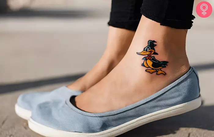 Woman with daffy duck tattoo on her ankle