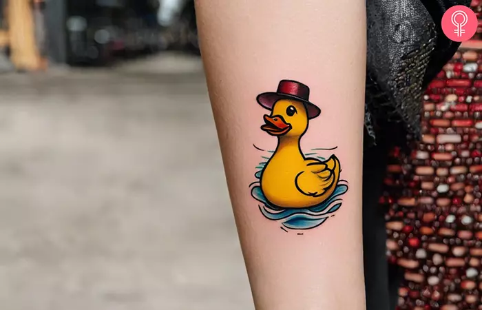Woman with rubber duck tattoo on her forearm