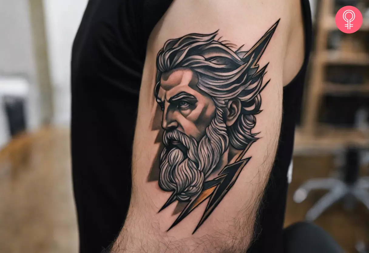 A Zeus lightning bolt tattoo on the upper arm