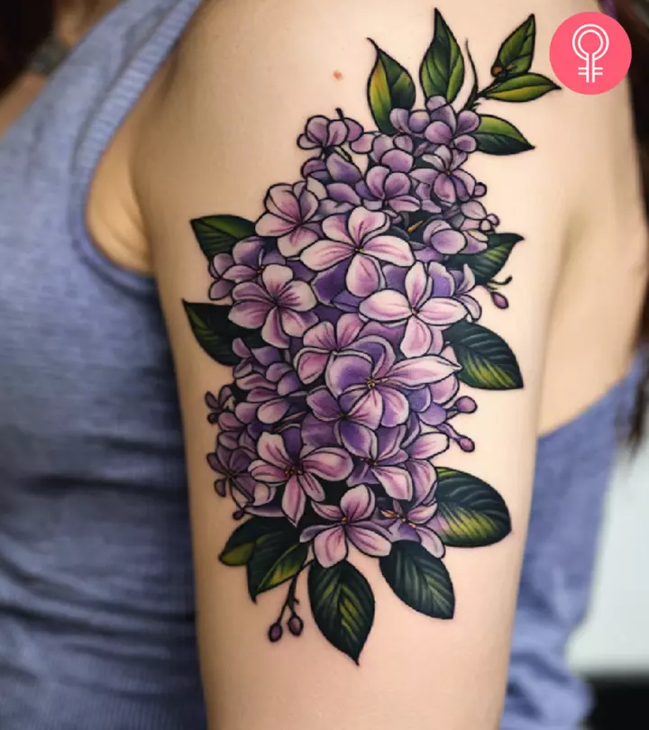 lilac tattoo on the upper arm