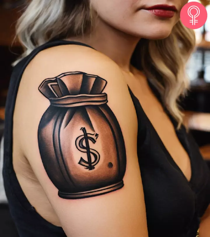 money bag tattoo on the upper arm