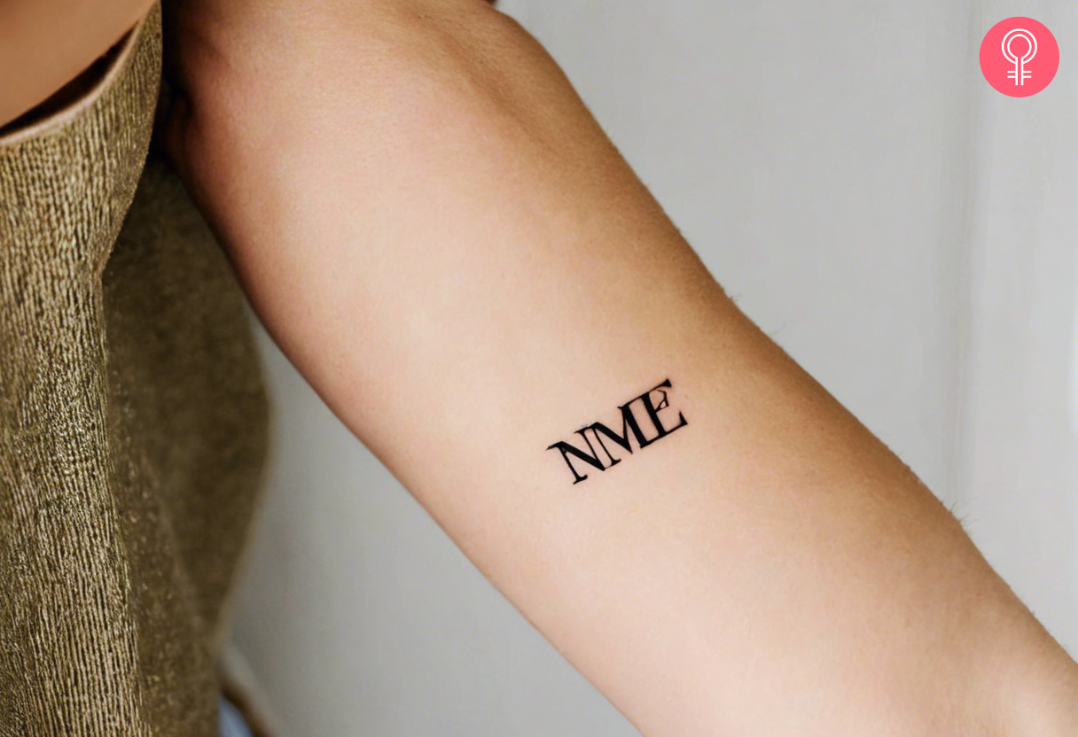 Woman with 3 initials tattoo on her inner arm