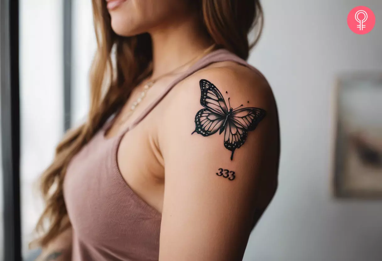 Woman with 333 butterfly tattoo on her arm