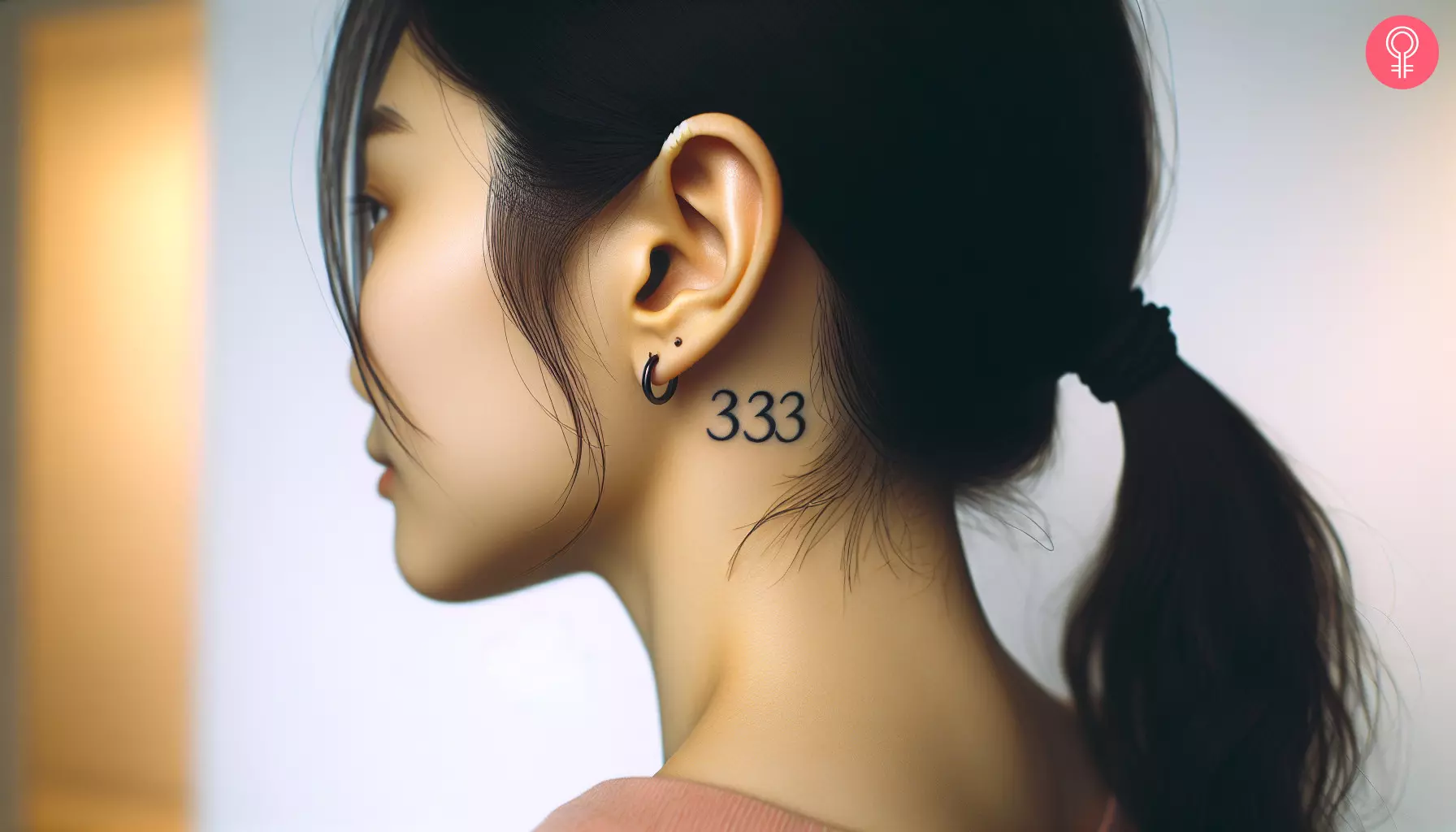 Woman with a 333 tattoo behind her ear