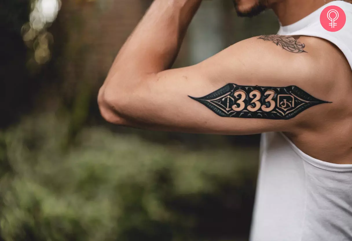 Man with a 333 tattoo on his outer arm