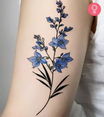 Woman with a forget me not flower tattoo on the neck