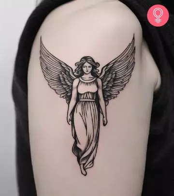A heart with wings tattoo on the upper arm
