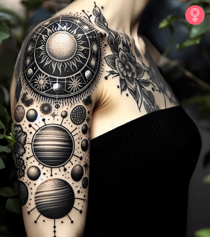 A woman with a solar system tattoo on her bicep