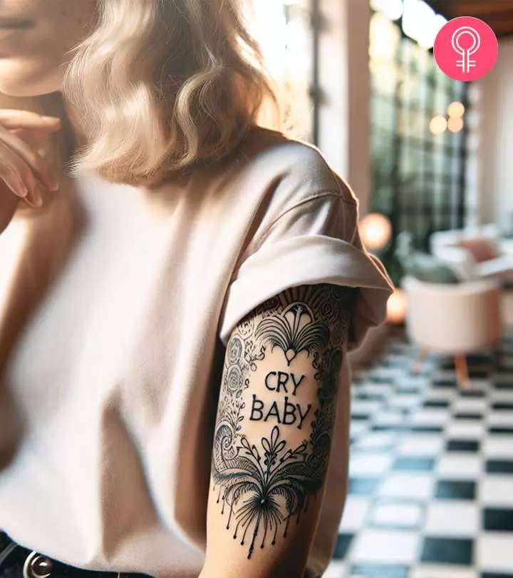 Cry Baby tattoo on the upper arm