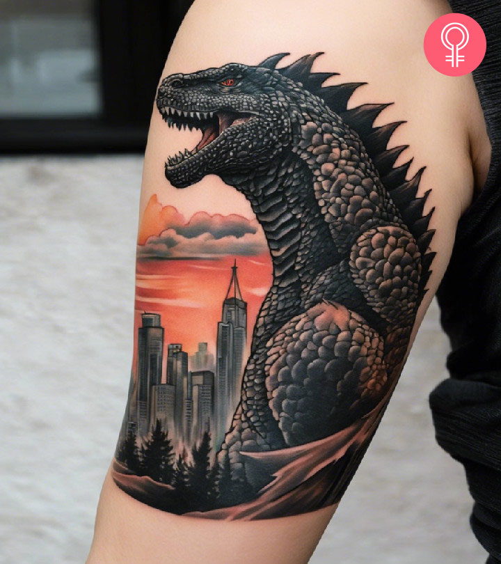 A Godzilla tattoo design on a woman’s arm